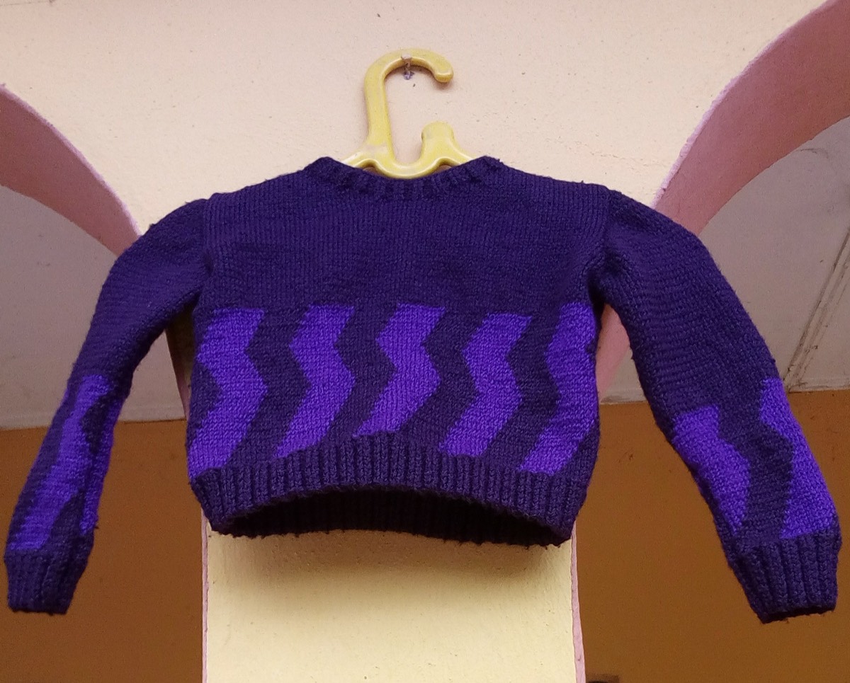 A hand-knitted sweater laid flat
