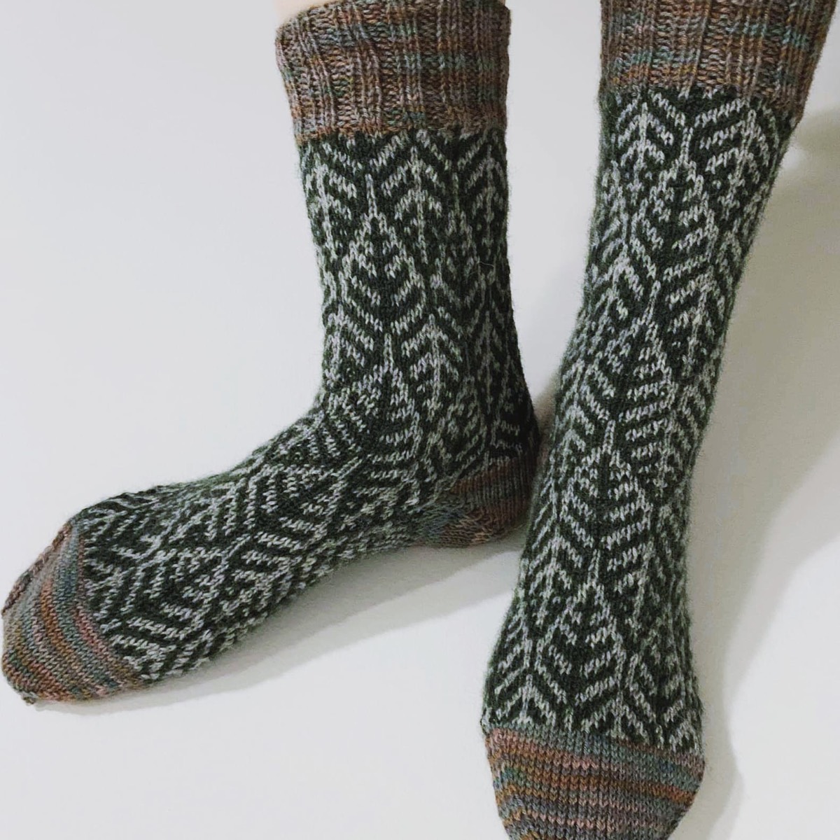 Hand-knitted socks with intarsia colourwork